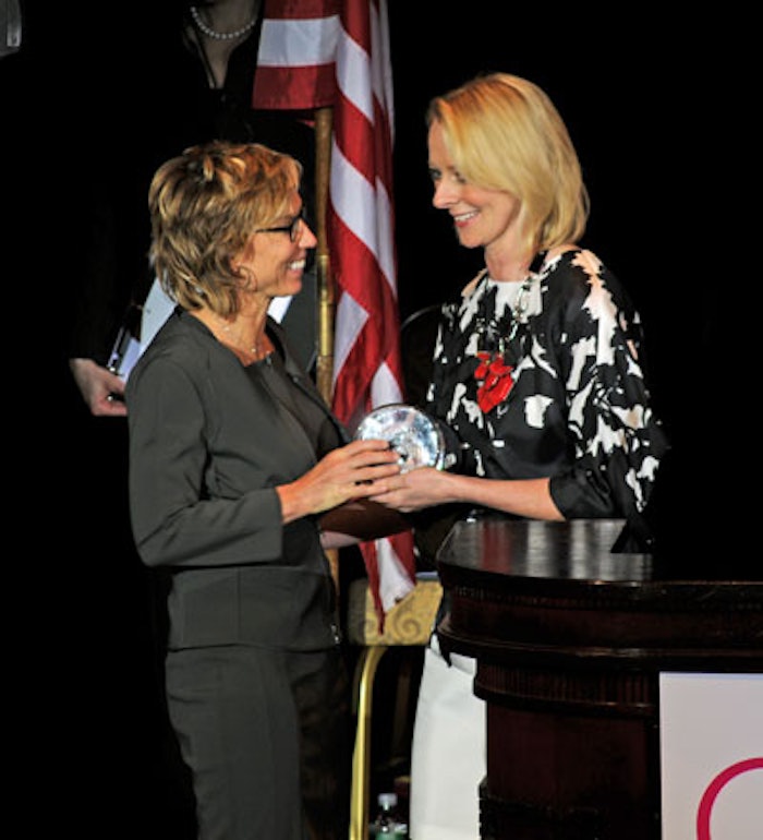 Melisse Shaban (left), CEO, Chrysallis, accepts the CEW Indie Beauty Award for the company's NIA 24 brand from Allure magazine's Linda Wells.