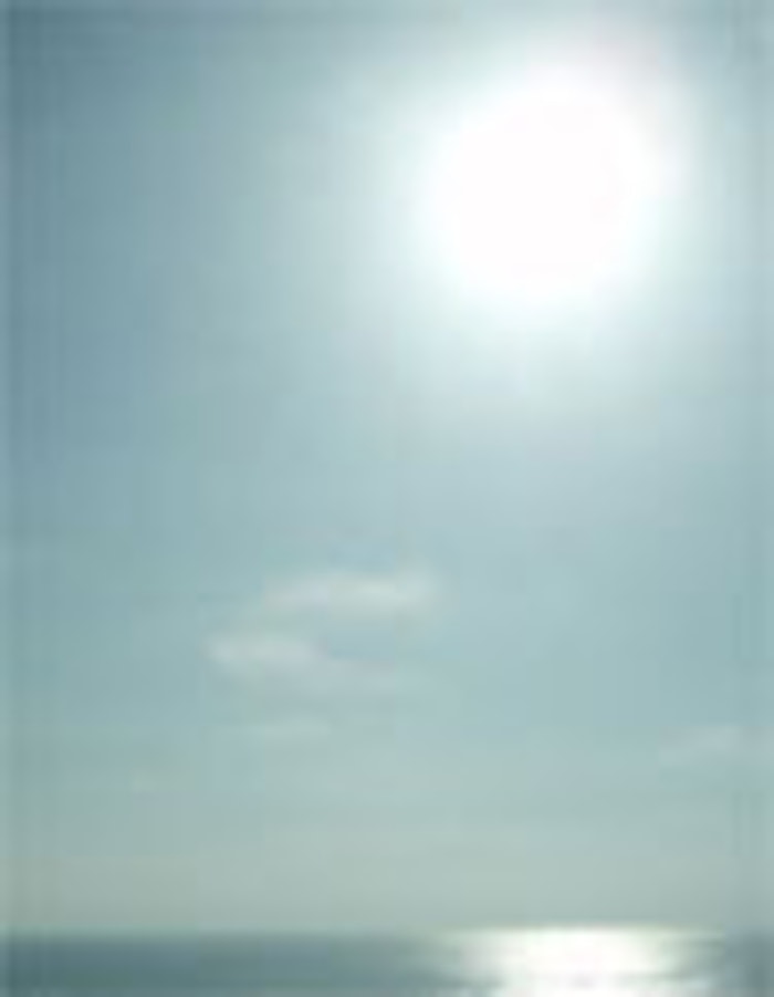 Bright sun reflecting off water