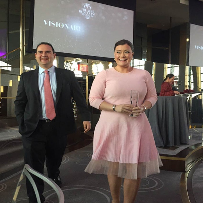 From left: IT Cosmetics co-founders Paulo Lima and Jamie Kern accept the 2015 WWD Beauty Inc. Award for Prestige Brand of the Year.