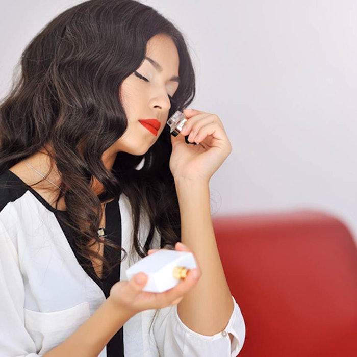 850-woman-smelling-perfume