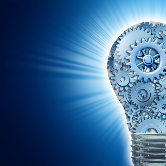 Innovation with ideas and concepts featuring a light bulb with gears and cogs working together as a team representing teamwork and financial planning with strategy on black background shining with radiating light burst.