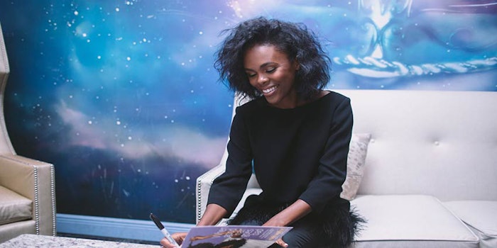 Nikki Walton of CurlyNikki.com signs copies of 'When Good Hair Goes Bad: Tips and Tricks for Restoring Your Gorgeous, Healthy, Natural Hair,' during her New Orleans book launch in partnership with Dark and Lovely.