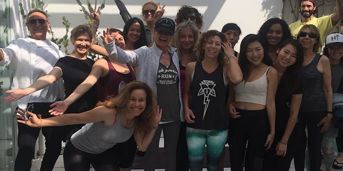 Ron Robinson (far left) has led his namesake beauty boutiques with great success by drawing in visitors with engaging events, including complimentary Yoga Saturdays (pictured).
