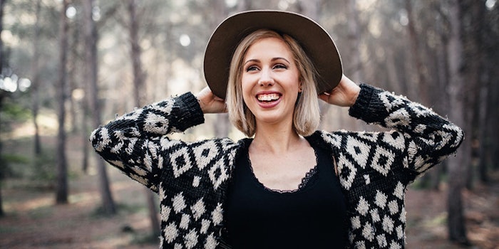 womansmilinginforest_425