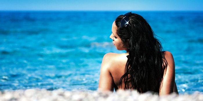 WomanBeachOceanSunning850x425