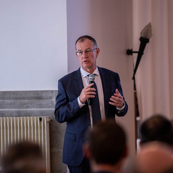 Hervé Schricke, Verescene's director of publishing, addresses an audience.