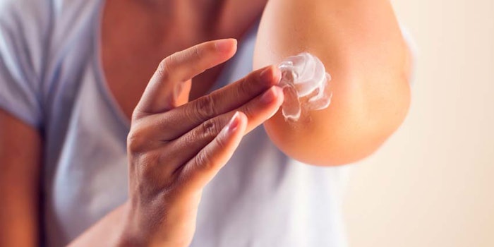 WomanAppliesMedicalCreamtoElbow_850x425