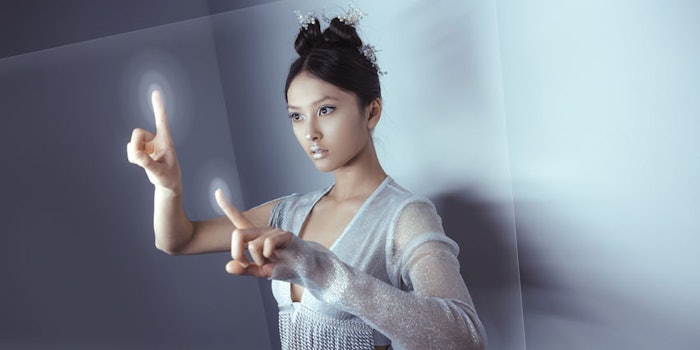 WomanInteractingComputerFutureTechBeauty_850x425