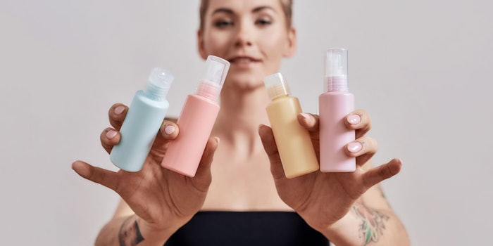 WomanTattooedArmsHoldingMultipleBottlesofLotions_850x425