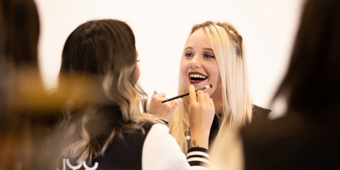 Content creator artStar applies NYX Professional Makeup to team captain Emuhleet of Dignitas.