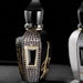 The parfum includes notes of bergamot, rum, patchouli, cinnamon, Bulgarian rose and more.