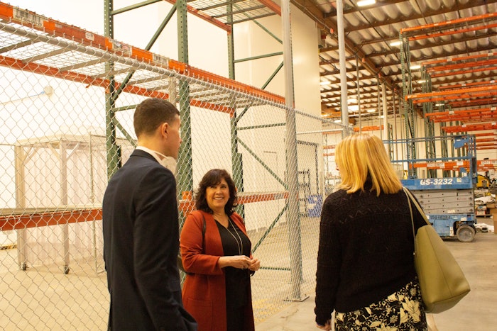 Andrea Chuchvara, CEO of Cosmetic Group USA, gives a tour to Jeb Gleason-Allured, content director of Global Cosmetic Industry, and Kim Jednachowski, the brand's sales lead.