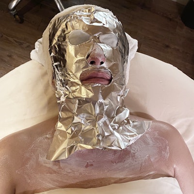 The tin foil kept the heat circulating within the mask to increase blood flow and promote collagen.