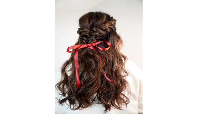See how to achieve Karla Valenzuela's half-up, half-down twisted braid.