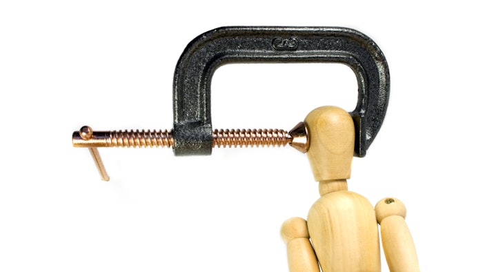 Stressed Out concept - wooden doll with vice on head