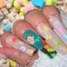Get a tutorial to create Lucky Charms nail art from nail artist Mayra Jones.