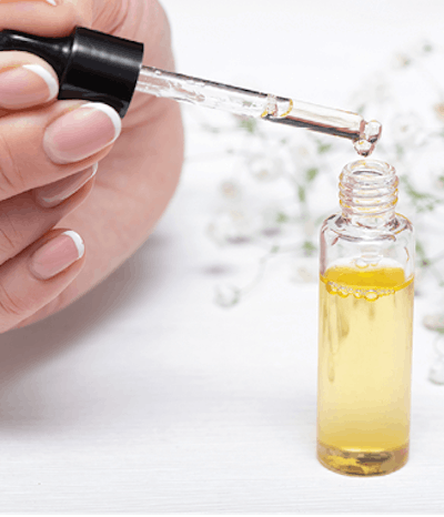 Apply cuticle oil twice a day, keeping the area moisturized. This will avoid dryness of cuticles and breakage that could make product lift earlier.