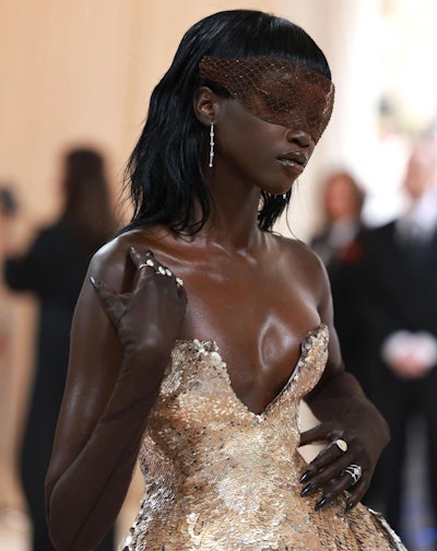 Anok Yai wore black metallic nails underneath sheer black gloves, making even her hands as attention-grabbing as everything else she wore.