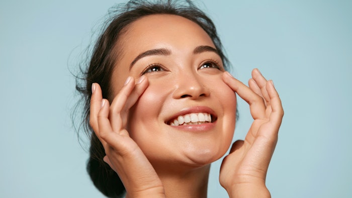 Asian woman with glowing radiant skin