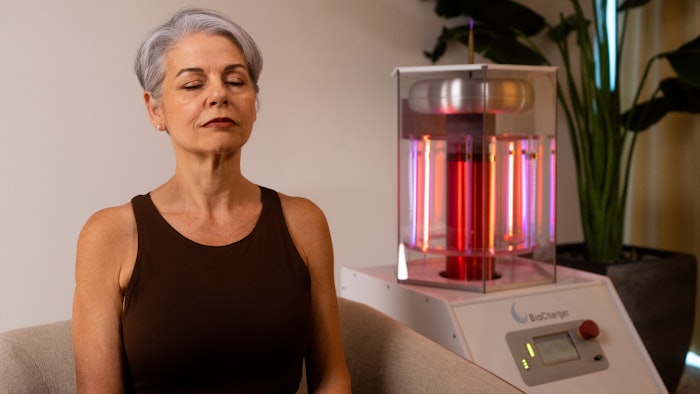 woman receives touchless biocharger treatment