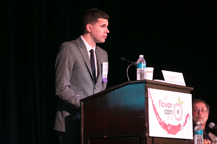 Allured Business Media content director and former Perfumer & Flavorist+ managing editor Jeb Gleason-Allured moderating the inaugural Flavorcon conference.