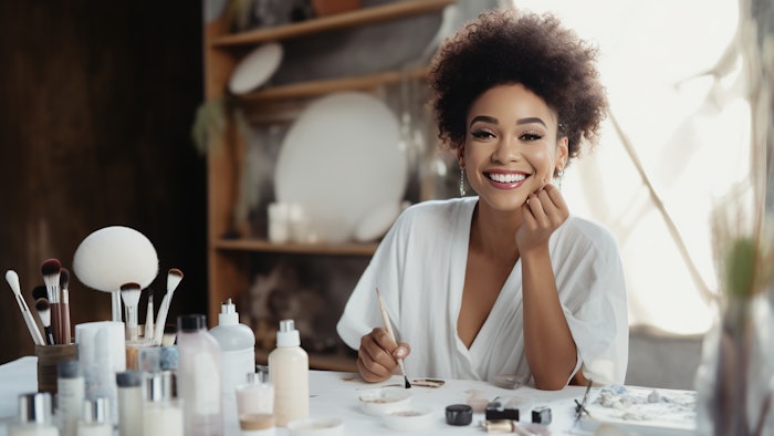 Black female beauty blogger. Female vlogger is showing cosmetics products while recording video