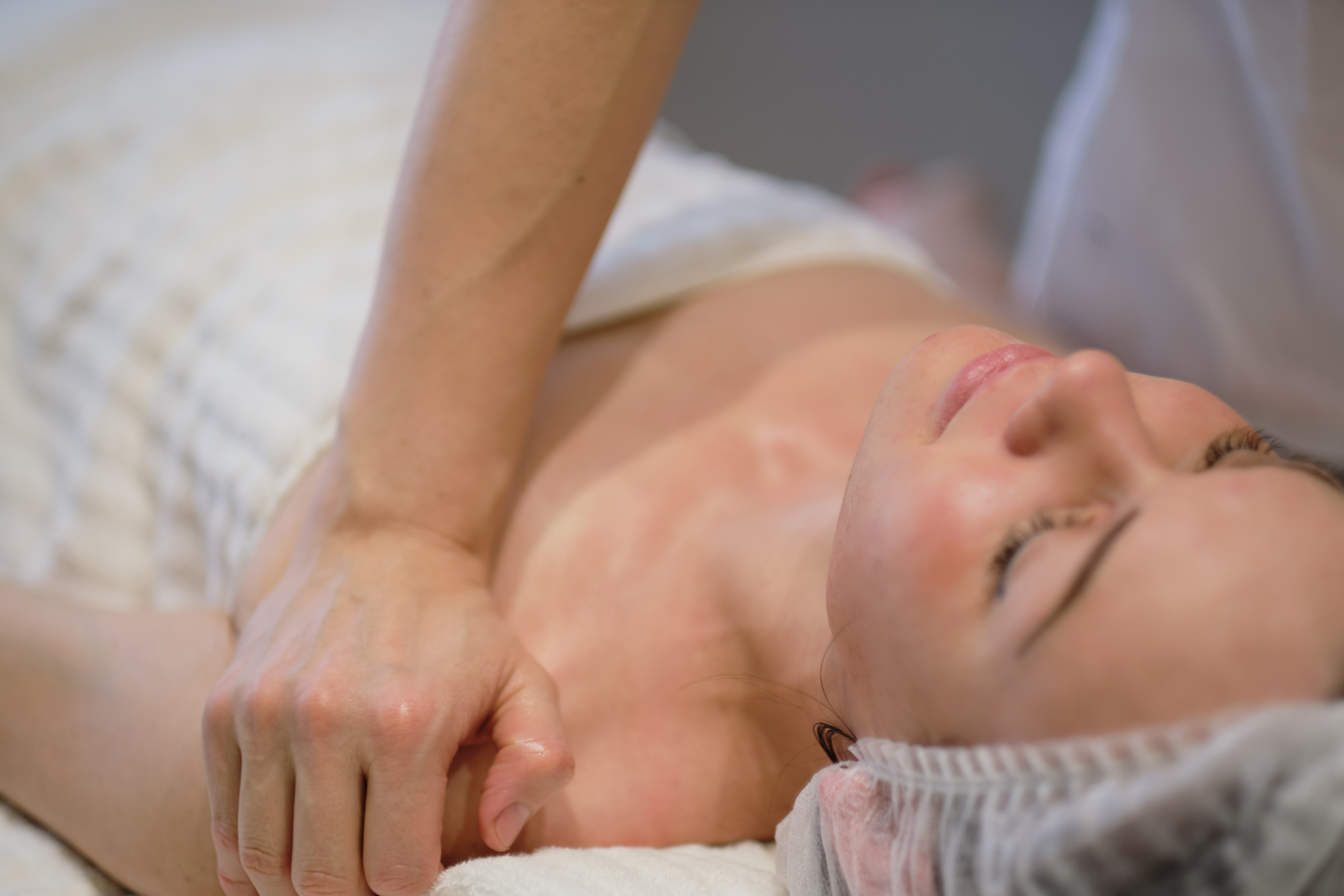 Facial skincare. Hands of masseur. Woman at beauty sp