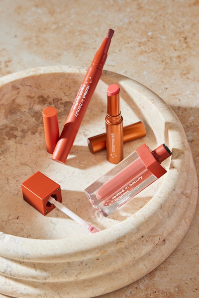 Cosmopak's sheer lip oil balm (center) is housed in the company’s Ecoforward Metal Slimstick and offes light application and slight laydown of pigments. Its lip gloss (foreground) features skin-friendly ingredients housed in the company’s magnetic vial for quick-release—with a pleasing, ASMR-like sound—and easy application. The range’s liquid lipstick pen (left/top), meanwhile, is housed in an airtight twist pen design for mess-free and precise, buildable application. The airtight pens are designed to extend the shelf life of products like liquid lipsticks, as well as eyeshadows and concealers. The available brush tips are reportedly easy to clean, while the pen’s valve evacuates all product.