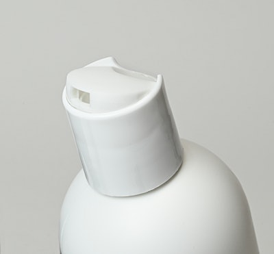 The disc-top closure features an integrated, concealed mechanism that requires more force to be applied upon initial opening, but thereafter operates as a standard disc top closure, per Aptar.