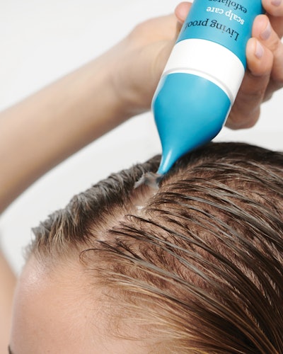 The exfoliator's packaging features a twist-cap applicator for precise dosage application, rendering the product usable for all hair types and styles, per the brand.