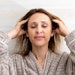 Woman Massaging Her Scalp Relaxed Happy Wearing Bath Robe Rahn Adobe Stock 558240989