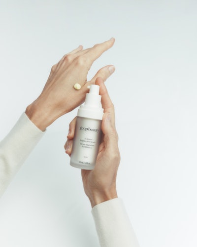 Woman's hand with dot of retinol skin care