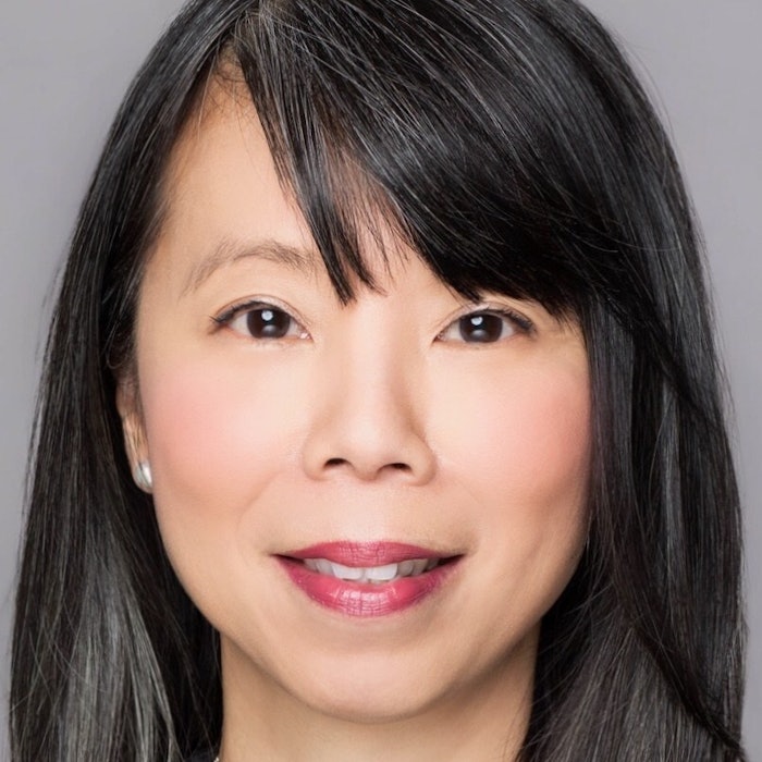 Portrait of JuE Wong, CEO of Performance Beauty Group