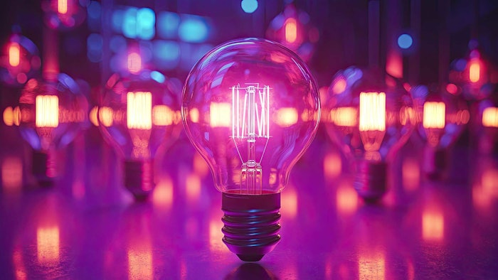 many lightbulbs lit pink color innovation concept