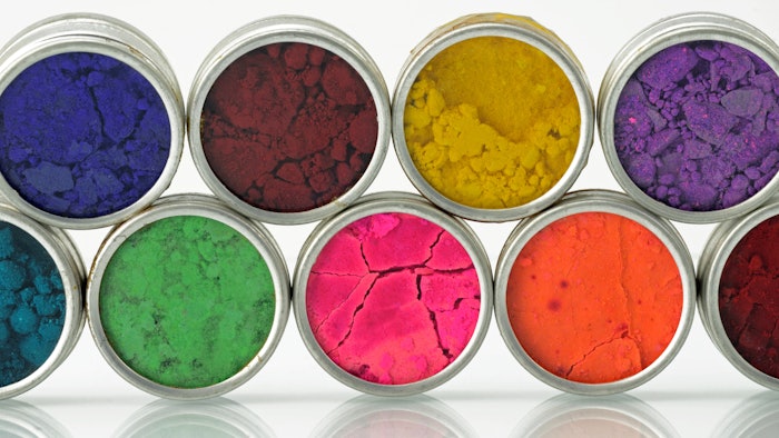 pigments in tins powder stacked turned