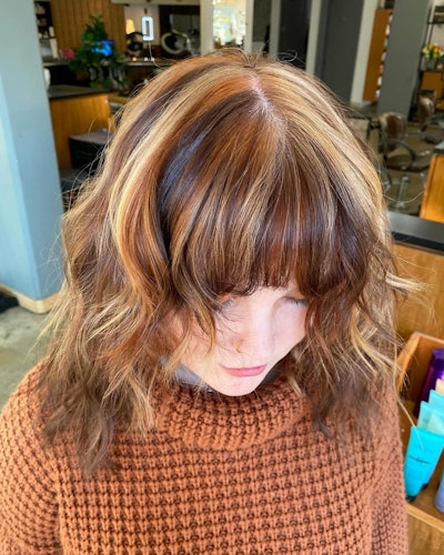 Calico hair trend with bangs and lighter brunette base