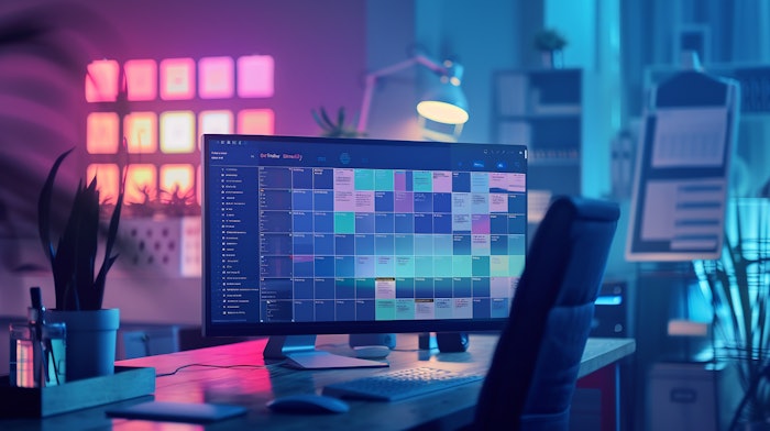 Computer Monitor With A Calendar App Open In A Home Office