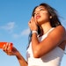 woman sunscreen face view looking up long brown hair