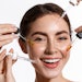 woman trying various serums skin care concept