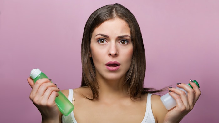 Woman Worried Products Bottles Adobe Stock 122832591