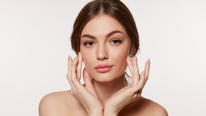 Beautiful Young Woman With Healthy Skin Slight Smile