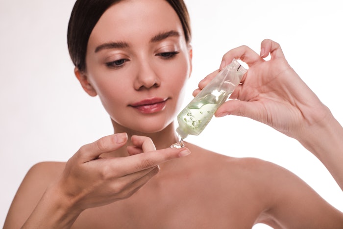 Woman Holding Clear Gel In A Tube Tinted Green Adobe Stock 310885271