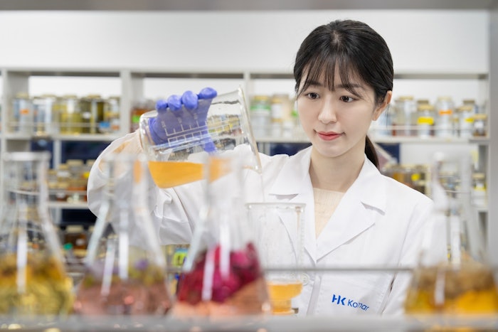The new factory will reportedly produce 120 million units annually, bringing its total U.S. output to 300 million units. (Pictured is a Kolmar worker in Korea.)