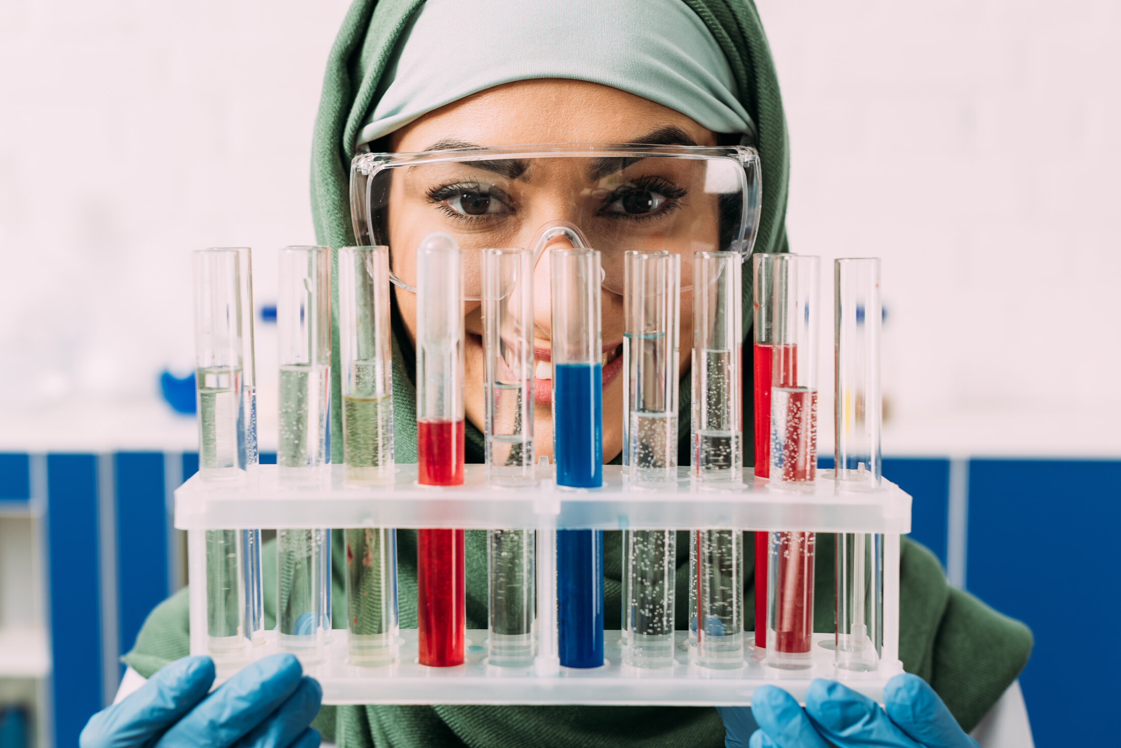 Beautiful Woman Muslim Chemist Smiling Holding Test Tubes Adobe Stock 251996580