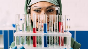 Beautiful Woman Muslim Chemist Smiling Holding Test Tubes Adobe Stock 251996580