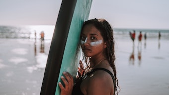 Surfer Girl Sunscreen Face Serious Beach Adobe Stock 389764371