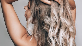 Woman With Beautiful Long Blonde Hair Wavy Held Above Her Head Adobe Stock 480419142