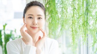 Beautiful Asian Woman White Background Bright Plants Hanging Nearby Natural Skin Care Concept Adobe Stock 278715489