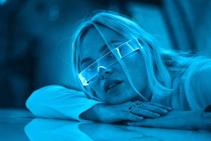 Woman Bathed In Blue Light Future G Adobe Stock 531268249