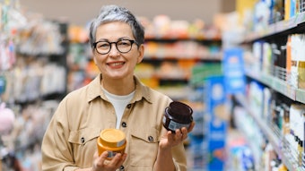Mature Beauty Shopper In Store Adobe Stock 1874708014
